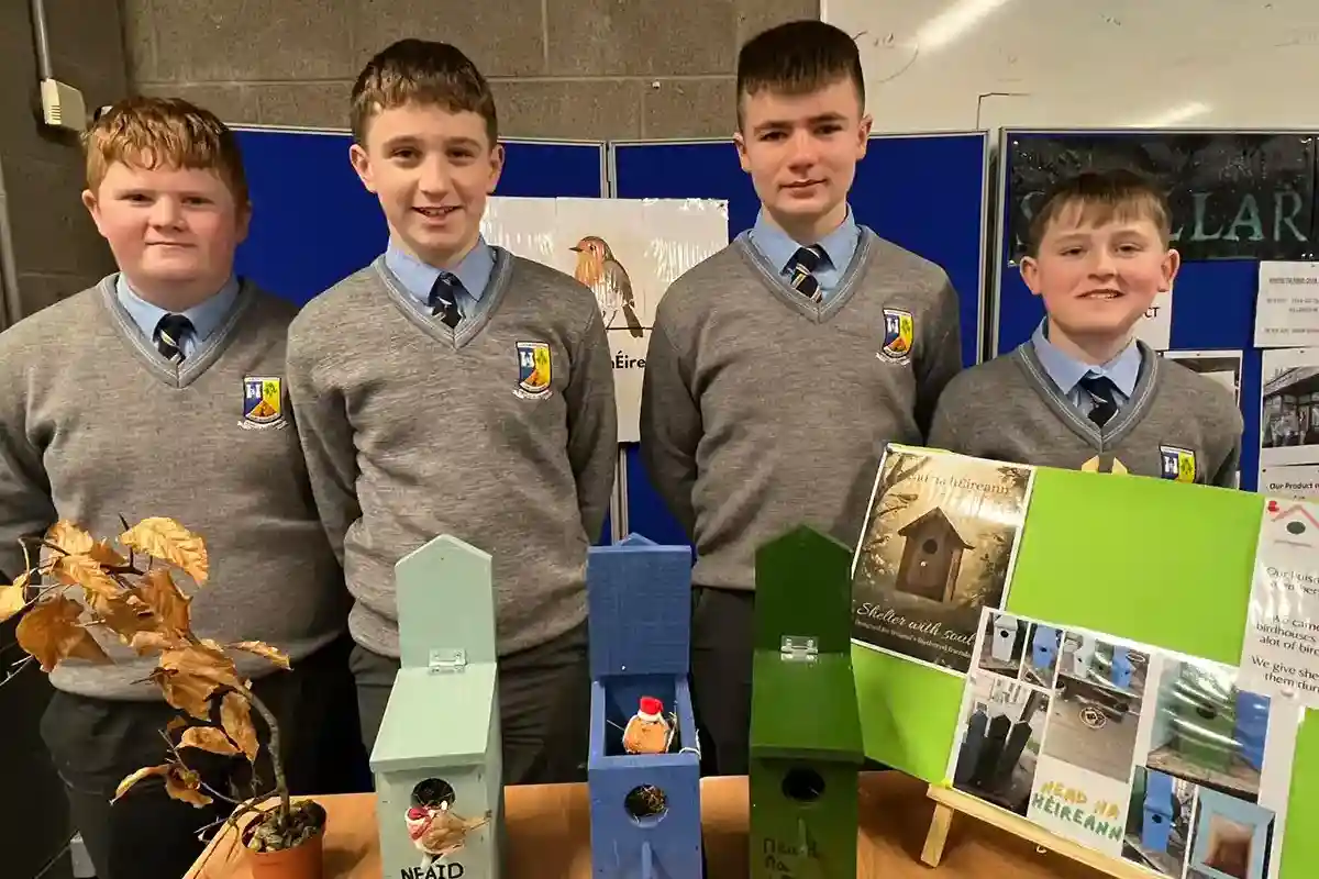 Boys standing with their Junior Business Cycle Project at St. Patrick's Boys Secondary School, Castleisland